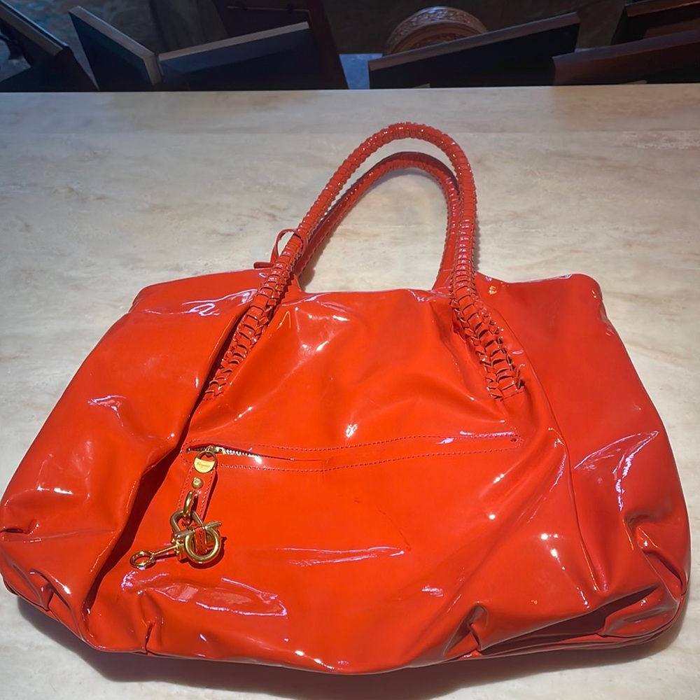 Salvatore Ferragamo orange patent leather satchel. Gently used.